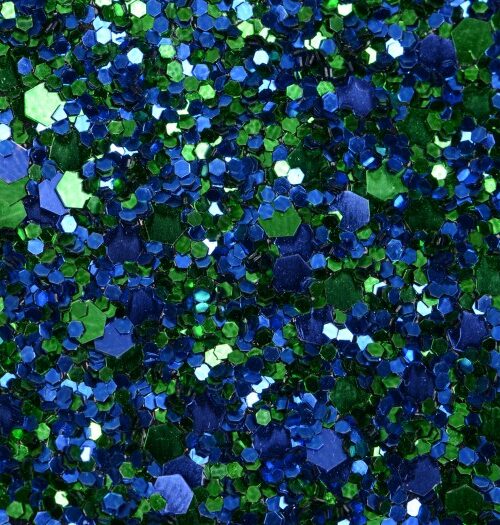 Glitter wallpaper encrusted with glitter pieces in a shade of blue and green from Glitter Bug Wallpaper.