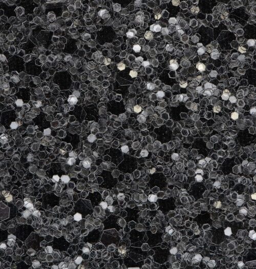 Glitter wallpaper encrusted with glitter pieces in a shade of black from Glitter Bug Wallpaper.