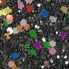 Glitter wallpaper encrusted with glitter pieces in a shade of black and multi colour from Glitter Bug Wallpaper.