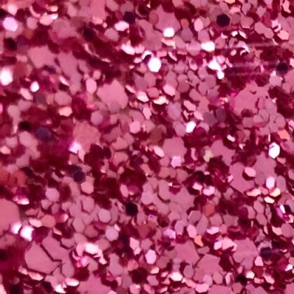 Glitter wallpaper encrusted with glitter pieces in a shade of pink from Glitter Bug Wallpaper.